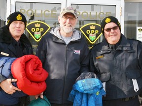 OPP Const. Kees Wijnands (left), Youth Centre Supervisor Dan Walker and OPP Sgt. Manny Coelho are prepared for the sleep-out this weekend at the West Perth OPP station. GALEN SIMMONS MITCHELL ADVOCATE
