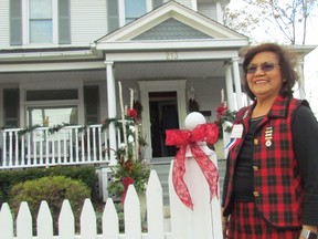 Linda Gryner, an organizer of the IODE Christmas Home Tour, stands on Saturday, Nov. 19, 2016 in Sarnia, Ont., outside the childhood home of the late Pauline McGibbon, a Sarnia native who served as Ontario's lieutenant-general, and was also a national president of the IODE. The home on Brock Street was part of this year's home tour, an annual fundraiser for the IODE in Sarnia-Lambton. Paul Morden/Sarnia Observer/Postmedia Network