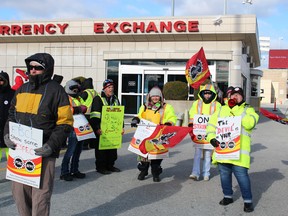 Blue Water Bridge workers rally outside the currency exchange building near the Canadian entrance of the international crossing. Close to 50 workers represented by the Public Service Alliance of Canada are on strike, following failed contract talks with the Federal Bridge Corporation. (Barbara Simpson/Sarnia Observer)