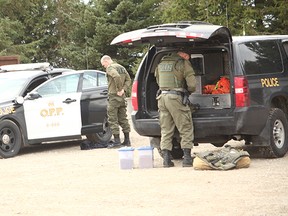 Emergency Response Team (ERT) suited up for the standoff that lasted more than four hours. The suspect was later apprehended without incident. He faces a number of violent charges.(Shaun Gregory/Huron Expositor)