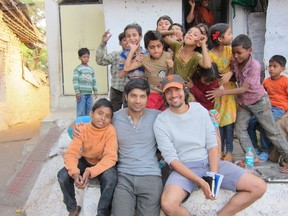 Sarnia's own Sami Khan (seated with baseball cap) and actor Rupak Ginn take a break with some children during the filming of Khan's first feature film, Khoya. cineSarnia will be screening Khoya at the Sarnia Public Library Theatre on Saturday, Nov. 22, with Khan participating in a q & a session following the film.
submitted photo for SARNIA THIS WEEK