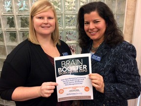 Dana Fallowfield, left, and Shelley Green of the Alzheimer Society of Oxford show off a post promoting their free upcoming event Brain Booster Workshop and Expo. (HEATHER RIVERS/WOODSTOCK SENTINEL-RIVERS)
