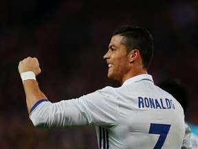 Real Madrid's Cristiano Ronaldo celebrates after scoring his side's third goal against Atletico Madrid during a Spanish La Liga soccer match between Real Madrid and Atletico Madrid at the Vicente Calderon stadium in Madrid on Nov. 19, 2016. (AP Photo/Francisco Seco)