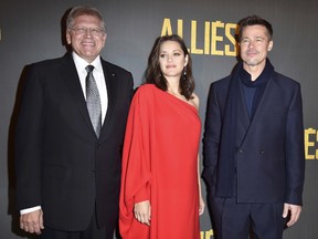 (L-R) Robert Zemeckis, Marion Cotillard and Brad Pitt attend the Paris premiere of the Paramount Pictures title "Allied" on November 20, 2016 at Cinema UGC Normandie on November 20, 2016 in Paris, France.  (Photo by Pascal Le Segretain/Getty Images For Paramount)
