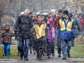 Residents gathered for a march against racism on Sunday, November 20, 2016, a day after a minor was charged for hate graffiti painted on several Ottawa buildings in the past week.    Ashley Fraser/Postmedia