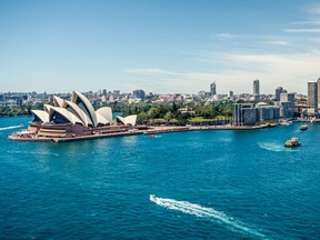 Sydney Opera House and Circular quay, ferry terminus, from the harbour bridge. (Getty)