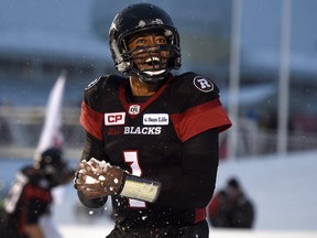 Ottawa Redblacks quarterback Henry Burris makes a snowball as he celebrates teammate Kienan Lafrance's touchdown during second half CFL Eastern Final action against the Edmonton Eskimos, in Ottawa on Sunday, Nov. 20, 2016. (THE CANADIAN PRESS/Justin Tang)