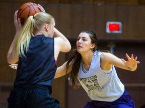 Julia Curran guards Megan Goar during a Western Mustangs basketball practice at Alumni Hall on Monday. Western is tied with Windsor atop the West division standings with four wins and no losses. Western battles Laurier Wednesday. (MIKE HENSEN, The London Free Press)