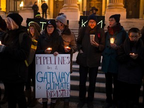 Participants takes part in a candlelight vigil at the Alberta Legislature as part of the national day of action against the Kinder Morgan pipeline. on Monday, November 21, 2016 in Edmonton.  Greg  Southam / Postmedia  (For a story Keith Gerein story.)