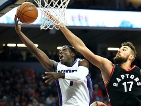 Sacramento Kings guard Darren Collison (7) drives to the basket around Toronto Raptors defender Jonas Valanciunas (17) during the second half of an NBA basketball game in Sacramento, Calif. on  Nov. 20, 2016.  (STEVE YEATER/AP)