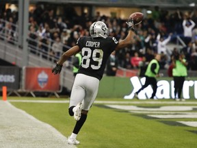 Oakland Raiders wide receiver Amari Cooper scores a touchdown during the second half of an NFL football game against the Houston Texans Monday, Nov. 21, 2016, in Mexico City. (AP Photo/Eduardo Verdugo)