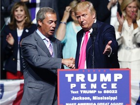 In this Wednesday, Aug. 24, 2016, file photo, then-Republican presidential candidate Donald Trump, right, welcomes pro-Brexit British politician Nigel Farage, to speak at a campaign rally in Jackson, Miss. Nigel Farage, the interim leader of the U.K. Independence Party, says he is "flattered" by Donald Trump's suggestion that he become Britain's ambassador to the United States. (AP Photo/Gerald Herbert, File)