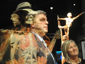 Guy Labine, Science North CEO and Jennifer Pink, Science North science director, check out "The Winged Man", part of the BODY WORLDS Vital exhibit at Science North in 2012. Sudbury Star file photo