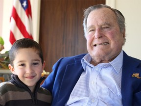 Former U.S. president George H.W. Bush tweeted this photo of him reunited with a boy named Patrick, who lost his hair to leukemia treatment. Bush shaved his head in July 2013 to show support for him.