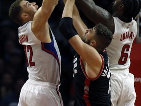 The superstar Los Angeles front court overwhelmed Jonas Valanciunas and the Raptors on Monday. AP