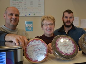 Perth County dairy farmers Hans and Jolanda Weber and Master Swiss Cheese Maker Ramon Eberle. (JOHN MINER, The London Free Press)