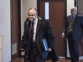 Toronto pastor Brent Hawkes, left, walks with his lawyer Clayton Ruby, right, at provincial court in Kentville, N.S. on Monday, November 14, 2016. (THE CANADIAN PRESS/Darren Calabrese)