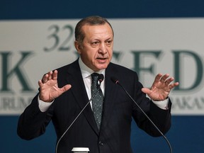 Turkey's President Recep Tayyip Erdogan addresses an annual economy and trade meeting of the Organization for Islamic Cooperation in Istanbul, Wednesday, Nov. 23, 2016. (Yasin Bulbul, Presidential Press Service/Pool Photo via AP)