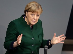 German Chancellor Angela Merkel speaks during a budget debate as part of a meeting of the German Federal Parliament, Bundestag, at the Reichstag building in Berlin, Germany, Wednesday, Nov. 23, 2016. (AP Photo/Michael Sohn)