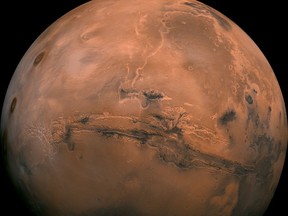 This image provided by NASA shows the planet Mars. (NASA via AP)
