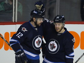 Drew Stafford (left) will make his return to the lineup on Wednesday night in Minnesota. (Brian Donogh/Winnipeg Sun file photo)