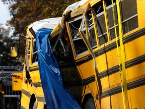 A tarp covers a section of the wreckage the day after a school bus accident, Tuesday, Nov. 22, 2016, in Chattanooga, Tenn.  (Doug Strickland/Chattanooga Times Free Press via AP)