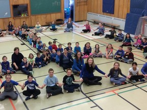 Jessica Salmon/ALCDSB Photo
Students and staff at Holy Name of Mary Catholic School in Marysville make a peace sign to symbolize peace for Bullying Awareness and Prevention Week.