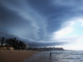 A large storm front moves over Manly Beach in Sydney, Australia, in this December 7, 2014 file photo.  (Photo by Cameron Spencer/Getty Images)