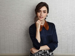 In this Nov. 11, 2016 photo, Lily Collins, a cast member in "Rules Don't Apply," poses for a portrait at the Four Seasons Hotel in Los Angeles. (Photo by Chris Pizzello/Invision/AP)