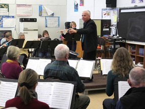 Dr. Chris Alfano, a music teacher at La Salle Secondary School in Kingston,  conducts his senior band. He has been awarded a national medal for his work integrating adults and students in his music program. (Michael Lea/The Whig-Standard)