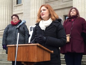 Lindsey Mazur speaks at a rally outside the Manitoba legislature on Wednesday. Mazur, a dietitian, and two dozen others called for a change to the province's human rights code to forbid discrimination based on a person's weight and physical size. (THE CANADIAN PRESS/Steve Lambert)