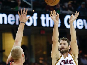 Cleveland Cavaliers' Kevin Love shoots over Portland Trail Blazers' Mason Plumlee during the first half of an NBA game on Nov. 23, 2016 in Cleveland. (AP Photo/Ron Schwane)