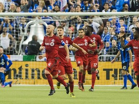 Despite the 3-2 loss in Montreal, TFC was smiling after two away goals in the first leg of the East final against the Impact. (The Canadian Press)