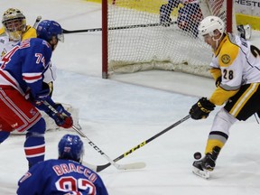 Sarnia Sting goalie Justin Fazio watches helplessly as teammate Kelton Hatcher tries to keep Kitchener Rangers forward Connor Bunnaman from tapping in a loose puck during the Ontario Hockey League game at Progressive Auto Sales Arena on Wednesday, Nov. 23, 2016 in Sarnia, Ont. Bunnaman scored two power-play goals as the Rangers won 6-3. (Terry Bridge/Sarnia Observer)
