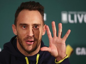 South Africa’s cricket captain Faf du Plessis opens his hand as he comments in Adelaide, Australia, on Nov. 23, 2016, after being found guilty and fined for ball tampering by the ICC. (RICK RYCROFT/AP)