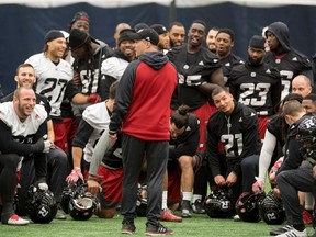 Redblacks head coach Rick Campbell talks to his team during practice yesterday. Ottawa is a heavy underdog heading into the Sunday’s Grey Cup. (Frank Gunn/The Associated Press)