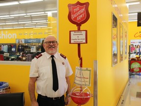 Maj. Roland Shea stands next to a kettle at the local Giant Tiger, one of four locations in town where the Salvation Army will be running its annual kettle campaign. JONATHAN JUHA/ STRATHROY AGE DISPATCH/ POSTMEDIA NETWORK