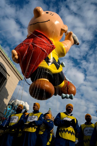 The Charlie Brown balloon floats over Central Park West during the Macy's Thanksgiving Day Parade in New York Thursday, Nov. 24, 2016. (AP Photo/Craig Ruttle)