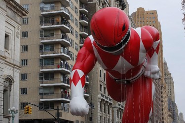 The Red Ranger balloon flies over Central Park West avenue during the 90th annual Macy's Thanksgiving Day Parade on November 24, 2016 in New York. (KENA BETANCUR/AFP/Getty Images)