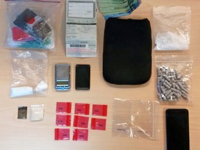 Drugs, cash and other property seized by Kingston Police from an accused who was arrested in Kingston, Ont. on Wednesday November 23, 2016. Photo supplied by Kingston Police