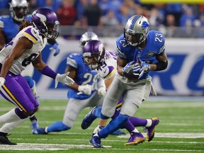 Lions cornerback Darius Slay (23) intercepts a pass intended for Vikings wide receiver Adam Thielen (19) during second half NFL action on Thanksgiving Day in Detroit on Thursday, Nov. 24, 2016. (Rick Osentoski/AP Photo)