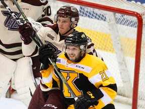 Kingston Frontenacs forward Ryan Cranford battles with Petes defenceman Matthew Spencer in front of the net during OHL action Nov. 3 in Peterborough. (Clifford Skarstedt/Postmedia Network)