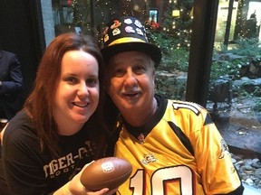 Hamilton Tiger Cats fans Gary Carlash and his daughter, Paige, at the Sheraton Centre on Nov. 24, 2016. (Joe Warmington/Toronto Sun)