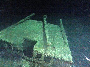 In this undated photo provided by Roger Pawlowski, the cabin and tiller of the "Black Duck" is shown in 350 feet of water off Oswego, N.Y. Underwater explorers say they've found the 144-year-old Lake Ontario shipwreck of the rare sailing vessel that typically wasn't used on the Great Lakes. Underwater explorer Jim Kennard says the Black Duck is believed to be the only fully intact scow-sloop to exist in the Great Lakes. (Roger Pawlowski via AP)