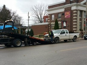 A white truck is towed November 25 after a couple sources say a man was tasered the day before by the OPP after reaching for something inside the vehicle. (Shaun Gregory)