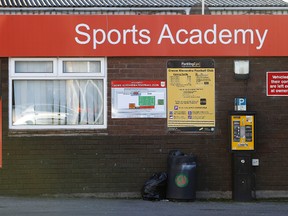 A sign for the sports academy of the English soccer team Crewe Alexandra at the Alexandra Stadium, in Crewe northern England Friday Nov. 25, 2016. Former soccer players who were subjected to years of sexual abuse by youth team coaches entrusted with their care are breaking cover to expose the English game's dark secrets. The abuses were first uncovered two decades ago with the conviction in the United States of English coach Barry Bennell, who coached at the academy of northern English professional club Crewe Alexandra, which was renowned as a center for turning raw talent into the complete footballer. (Martin Rickett/PA via AP)