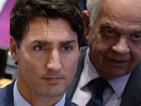 Immigration, Refugees and Citizenship Minister John McCallum sits with Prime Minister Justin Trudeau as he co-hosts the Leaders’ Summit on Refugees at the United Nations headquarters in New York on Tuesday, Sept. 20, 2016. THE CANADIAN PRESS/Sean Kilpatrick