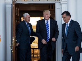 Drew Angerer/Getty Images
Vice-president-elect Mike Pence, from left, president-elect Donald Trump and Mitt Romney leave the clubhouse after their meeting at Trump International Golf Club last Saturday in Bedminster Township, N.J. Trump and his transition team are in the process of filling cabinet and other high-level positions for the new administration.