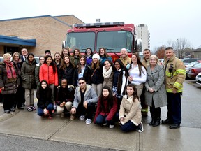 Staff and students from Catholic Central secondary school with members of the London Fire Department November 24, 2016. CHRIS MONTANINI\LONDONER\POSTMEDIA NETWORK
