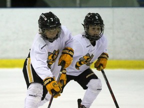 From left, Ethen Fines and Jack Rombouts from the Lambton Jr. Sting minor atom AAA hockey team execute a drill during practice at Progressive Auto Sales Arena on Wednesday, Nov. 23, 2016 in Sarnia, Ont. The Jr. Sting are in Buffalo this weekend for the Harbor Centre Cup. (Terry Bridge/Sarnia Observer)